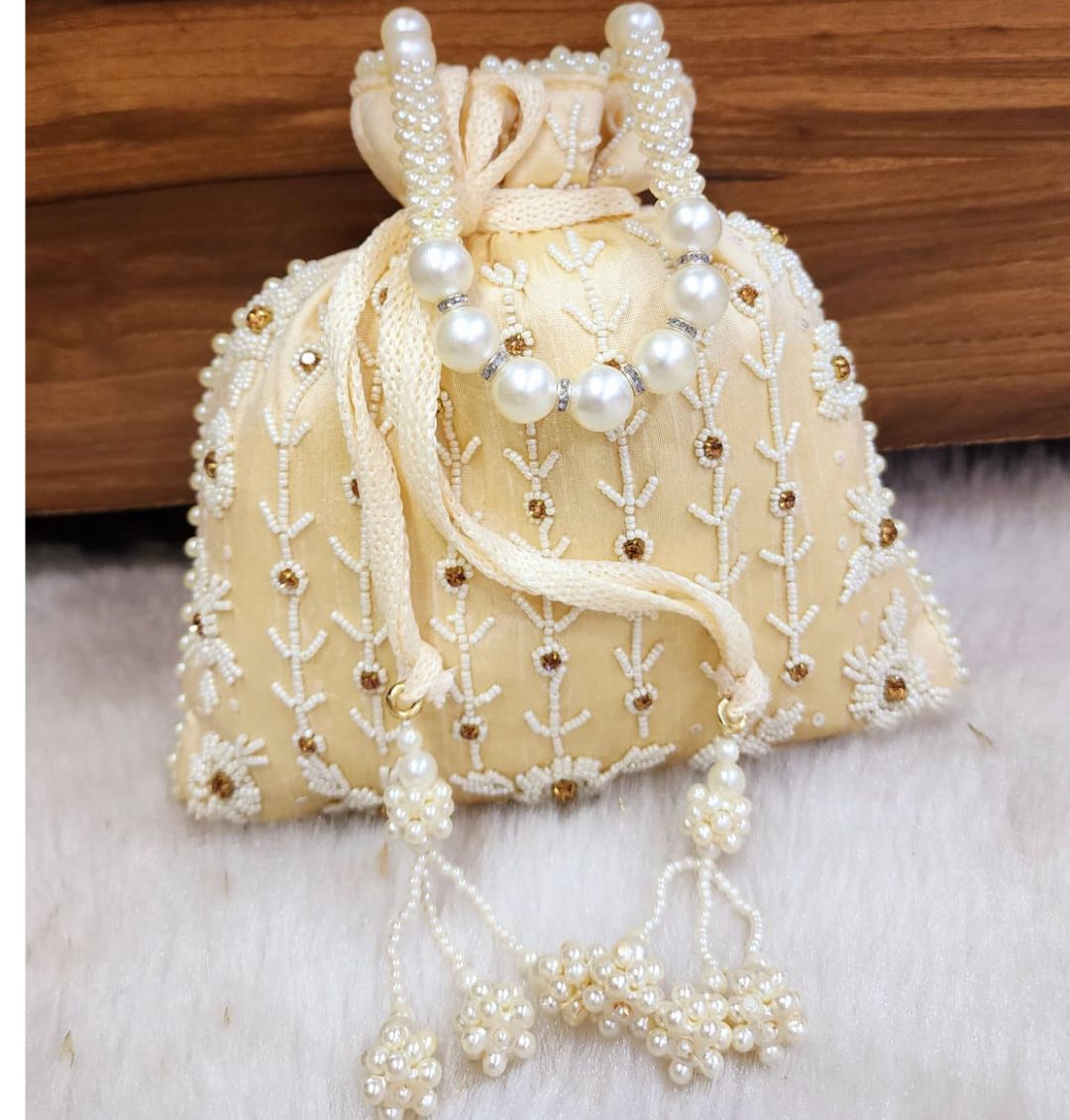 Designer Tubelight Singh Partition Silk Handcrafted Potli in Light Cream color-81653