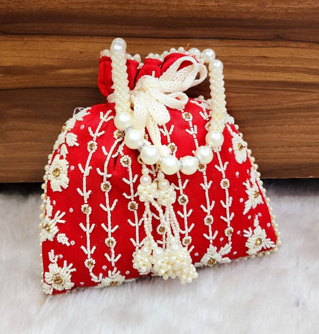 Tubelight Singh Partition Silk Handcrafted Potli in Red color-81657